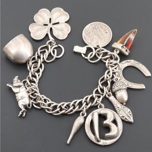 Sterling charms bracelet 
Materials: Metal
Bracelet Length: 7.00"